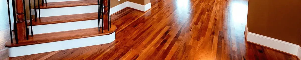 Base floor of a staircase with professionally restored wood flooring in Kansas City MO