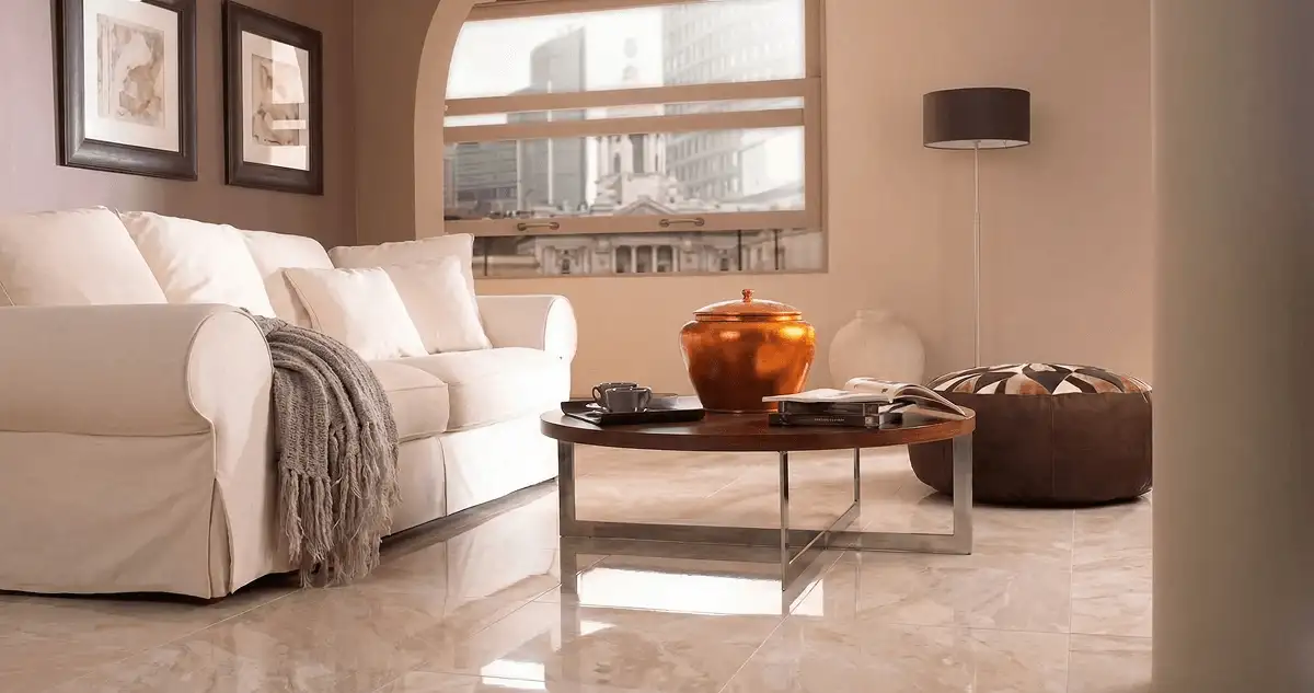 Modern living room with professionally installed marble flooring, a beige sofa, coffee table in Kansas City, MO