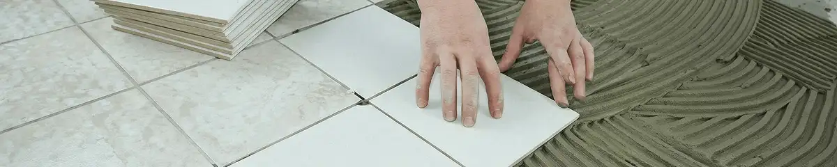 Professional installing white tile floors in Kansas City, MO