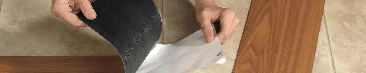 A professional installing vinyl flooring in Kansas City, MO